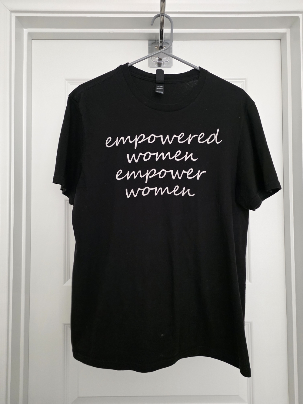 District Black Tee with White "Empowered Women Empower Women" Script